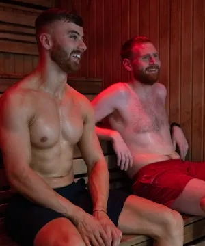 two people relaxing in a sauna 